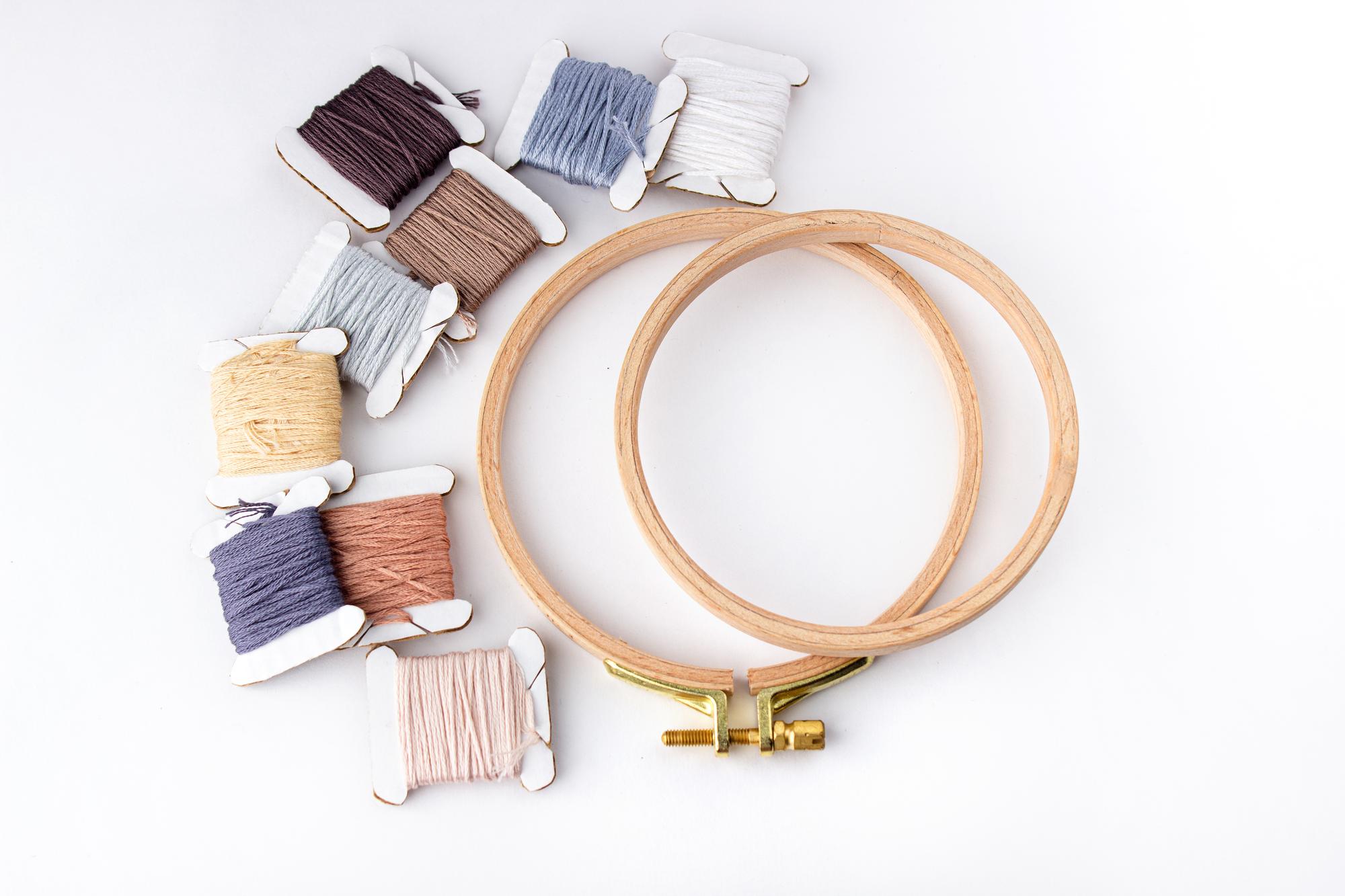 Three embroidery hoops displayed on table